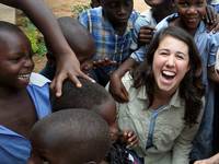 Meghan Gallagher playing with children in Uganda